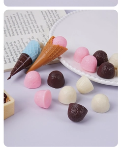 Macro shot of 2cm faux chocolate hemispheres and mini ice cream cones for DIY dessert crafts