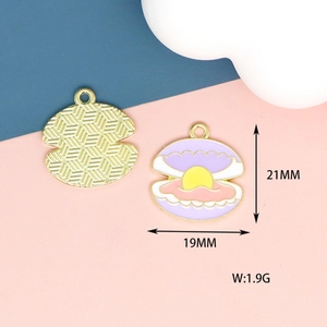 Detail view of 21mm enamel shell charms with pearls showing size and golden metal back