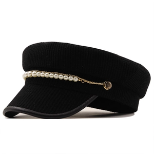 Women's black corduroy newsboy hat with pearl chain trim and stylish leather edge