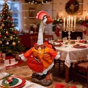 Close-up of 23-inch porch goose in turkey outfit with pumpkin bag for Thanksgiving decor