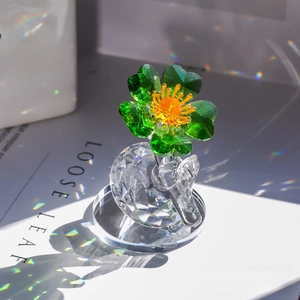 Macro shot of green faceted crystal flower ornament with sparkling rainbow light effect