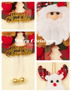Detail of Christmas Santa and reindeer ornaments with Merry Christmas sign and golden bells