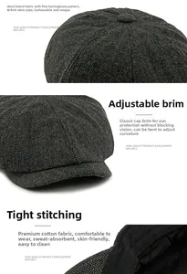 Detailed close-up of dark grey wool blend newsboy hat with classic herringbone texture
