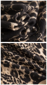Macro shot showing the soft cashmere-like texture and classic leopard print pattern