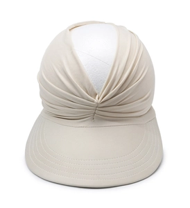 Detailed macro view of the beige pleated fabric texture and sun visor stitching