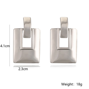 Detailed view of silver rectangular geometric earrings showing size 4.1cm and 2.3cm