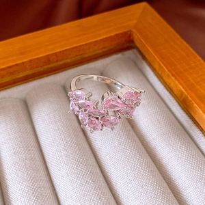 Detailed shot of pink pear-cut zircon stones cluster set on a silver adjustable ring band