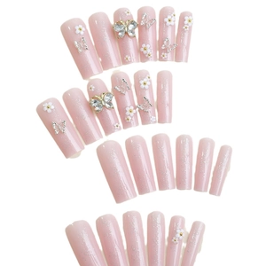 Pink press-on nails with 3D silver butterflies, white flowers and glitter details