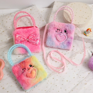 Detail of plush cartoon rabbit bags with sequins, bows and cat face embroidery details