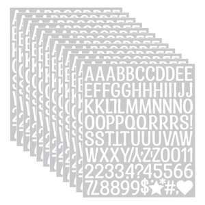 Macro view of 12 white vinyl alphabet stickers with bold handwritten fonts for DIY crafts