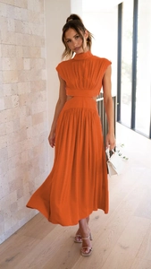 Vibrant orange midi dress with high neck and waist cutouts in light pleated fabric