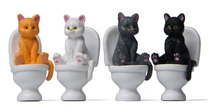 Detailed set of four creative miniature resin cats sitting on toilets for garden decor