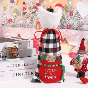 Christmas wine bottle cover with red and black buffalo plaid and embroidery design