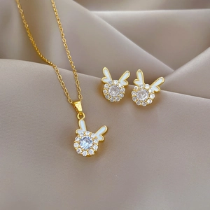 Golden dragon year necklace and stud earrings set with white enamel and crystals