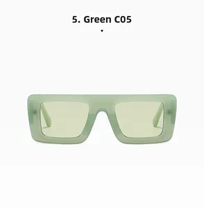 Close-up of vintage square green sunglasses with thick frames and matching lenses