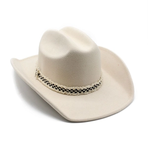 Detail of beige felt cowboy hat with checkered ribbon trim and frayed edge
