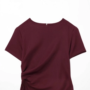 Fashionable burgundy puff short dress with unique pleated knot detail on white background