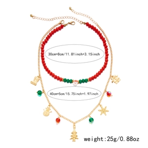 Christmas necklace set size details with layered red beads and gold festive pendants
