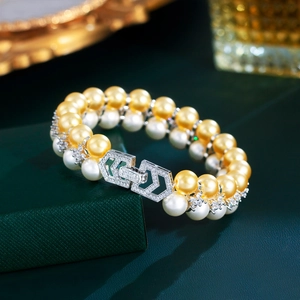 Macro view of luxury double-layer pearl bracelet with zircon geometric clasp detailing