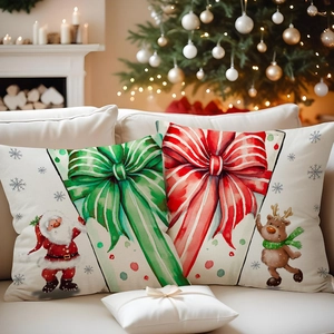 Christmas pillow covers with Santa and reindeer patterns on a beige sofa by a cozy fireplace