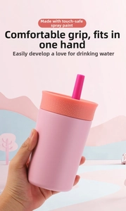 Pink matte stainless steel tumbler with textured lid and straw in hand for easy carrying