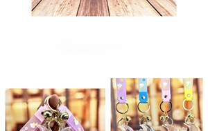 Detail of colorful quicksand moon rabbit keychains with silicone wrist straps and bells