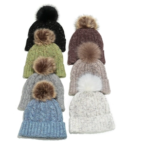 Chunky knit pom-pom beanies for women in seven mixed-color styles with faux fur toppers