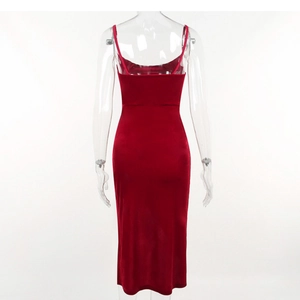 Detail view of deep red velvet midi dress featuring slim straps and tight-fitting cut
