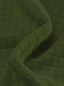 Close-up of olive green waffle knit fabric showing texture and soft material details