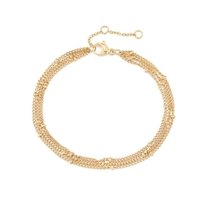 Macro detail of gold-layered bracelet showing tiny beads and adjustable lobster clasp