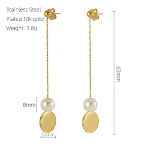 Detail of 18k gold plated stainless steel long tassel earrings with white pearls