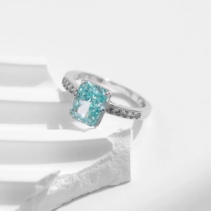 S925 Sterling silver ring with large rectangle paraiba blue stone on geometric background