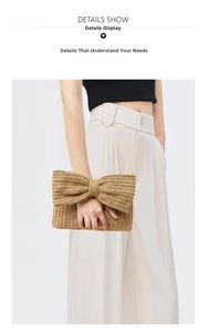 Macro shot of natural straw clutch bag featuring a prominent decorative woven bow