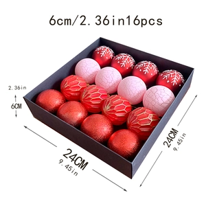 Detail of 16pcs Christmas ball set in black box featuring red and pink patterns