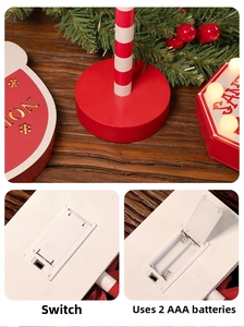 Close-up of LED Christmas wooden stop sign back with battery compartment and power switch