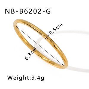 Detailed view of golden spiral textured bangle with dimensions 6.3cm inner diameter