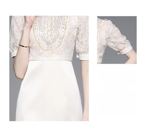 Detailed view of white lace patchwork with intricate silver beadwork and sequins