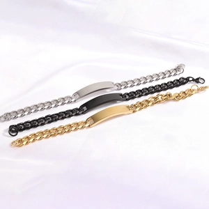 Three Cuban chain bracelets in silver, black and gold finish on white silk background