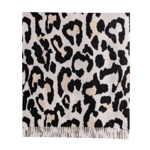 Soft faux cashmere scarf with black cow pattern print and fringe hem for winter warmth