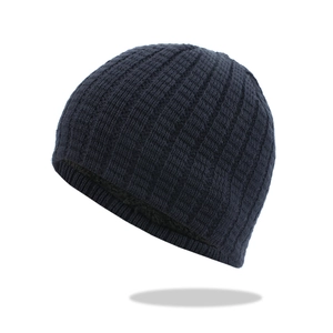 Detailed view of dark blue ribbed knit beanie with soft black fleece lining for winter