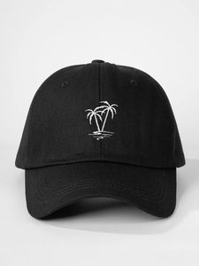 Detailed view of white palm tree embroidery on the front of a black cotton baseball cap