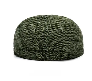 Rear view of herringbone newsboy cap showing classic olive tweed texture and stitching