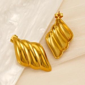 18K gold-plated wing earrings on white marble and beige silk, elegant jewelry for women