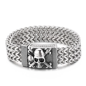 Men's gothic stainless steel bracelet featuring a skull crossbone clasp and braided chain