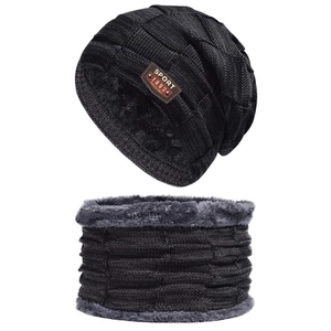 Close-up of knit beanie and neck warmer set with thick grey fleece lining and sport badge