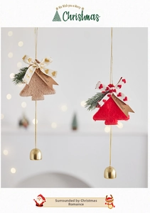 Detail of plush Christmas tree ornaments with golden bells and faux fur heart bows