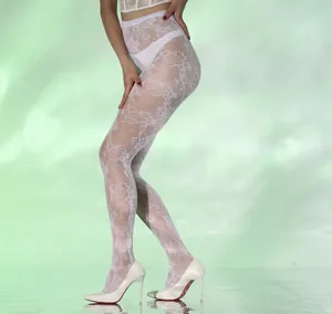 Detail of white floral lace pantyhose showing intricate knit texture and pattern