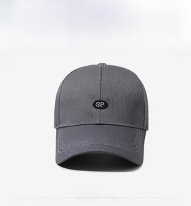 Front view showing grey baseball cap with SP embroidery and stitched peak details