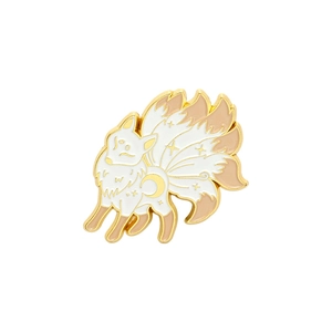 Detailed view of nine-tailed fox enamel brooch with gold plating and moon motif