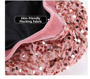 Detail of pink flocked fabric with rose gold sequins on a stylish beret hat